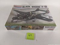 Top view of the sealed model kit box showing the Black Widow P-61 aircraft model depiction and size scale.