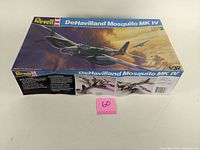 Box front and side view of vintage Revell DeHavilland Mosquito MK IV 1:32 scale model kit with detailed aircraft artwork.