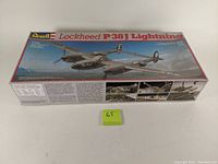 Boxed plastic model kit of the Lockheed P-38J Lightning with Revell branding and aircraft artwork on the lid.