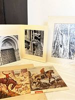 Three Harold Sorensen black and white prints with soiled mats are displayed behind two colored magazine or advertising prints showing Western horse riders on horseback.