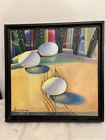 Full frontal view of the original oil painting featuring three white eggs on wooden surface and dark table legs background, signed Daniela Oey
