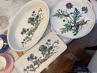 Three Villeroy & Boch ceramic serving dishes with botanical Viola flower pattern displayed on table