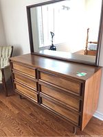 Front view of dresser with attached mirror on top