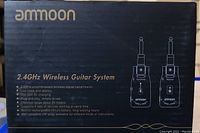 Front of box for the ammoon 2.4GHz Wireless Guitar System showing product features and brand name
