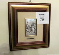 Front view of framed silver etched plate artwork, showing the street scene etched on the silver plate.
