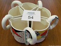 Top view of five mugs stacked inside each other showing their unique shape and handles forming a circle