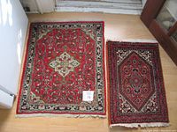 Both rugs laid side by side on wood floor