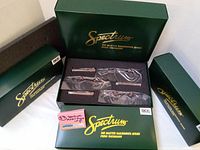 Four green Bachmann Spectrum boxes of various sizes with DCC On Board labels