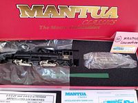 Overall view of the Mantua Classics red box with two articulated locomotives and a tender inside, wrapped in plastic for protection.