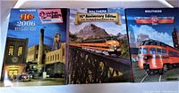Three Walthers HO Model Railroad Reference Books from years 2006, 2007 75th Anniversary Edition, and 2008 standing side by side, showing front covers with train imagery and HO scale model scenes.