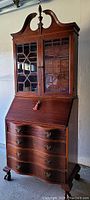 Full view of front showing upper hutch, drop-front desk and lower drawers