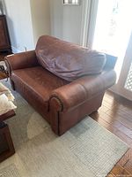 Front-left view of the entire chair showing overall style and condition