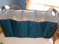 Top interior view of the expanded container showing multiple rigid pleated compartments and reflective insulated lining