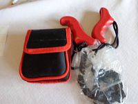 Clear photo of the tree branch cutting kit showing pouch, handles, and coiled chain in plastic wrap.