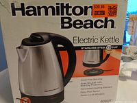 Photo of the Hamilton Beach electric kettle box front showing the kettle image and branding with price sticker.