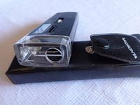 Close-up photo showing the lens and LED light source of the Micronta microscope with the transparent cover at one end.