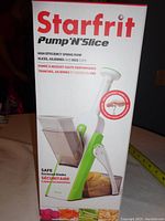 Box front showing brand, model name, and product image highlighting the design and function of the slicer.