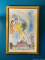 Full view of framed Marc Chagall lithograph against blue wall