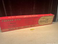Original red box of the Fokker DVII model plane by Sterling, showing branding and model name on the sides
