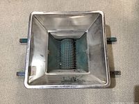 Top view of the metal grape crusher hopper and rollers, showing the full crushing area and metal rollers with spikes.
