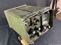 Angled front-left view showing housing, control knobs and connectors.