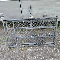 Front view of folded steel mesh carrier mounted to hitch