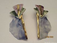 Pair of vintage ceramic earrings with purple, green, gold colors and abstract shapes shown on white background