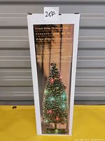 Box showing the 14 inch Glitter Christmas Tree with battery powered LED lights and ornaments.