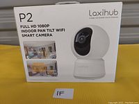 Front view of Laxihub P2 camera box showing product image and specifications such as Full HD 1080p, indoor pan tilt WiFi smart camera.