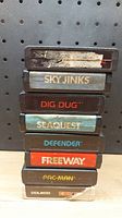 Stacked view of cartridge labels showing game titles.