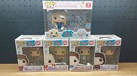 7 Funko Pop figures from The Brady Bunch series arranged on shelf showing front of boxes