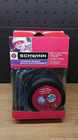 Front view of Schwinn training wheels packaging showing product and branding.