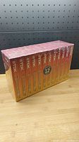 12-pack of TDK blank VHS tapes sealed in original packaging with red-yellow gradient box and TDK logos.