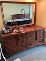 Front view of Gibbard dresser with mirror, showing all drawers and decorative pulls.