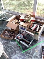 Multiple boxes with Hornby Dublo rolling stock, locomotives, track, switches, books, model kits and paints