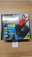 Front view of the product box showing branding, product features, and an image of a man exercising with the ball.