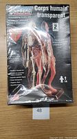 Photo of the sealed box of Lindberg Transparent Human Body Model Kit showing front cover with transparent body illustration and text in English and French
