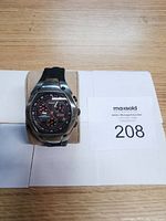 Front view of Timex Ironman Triathlon wristwatch on a display cushion showing the dial and buttons clearly.