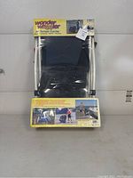 Photo of boxed Wonder Wheeler All Terrain Carrier showing full product with label and instructions on the packaging.