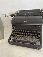 Black Royal vintage typewriter showing full keyboard and carriage return lever