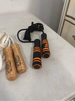 Wooden handle jump ropes and black foam handle jump rope with orange stripes