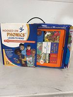 Boxed set of Hooked on Phonics Learn to Read showing the front side of the box with images of children and text about the program.