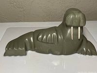Front view of green-grey soapstone walrus sculpture