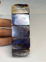 Front view of the abalone panel bracelet showing natural iridescent colors and rectangular panels.