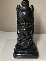 Front view of carved totem pole sculpture