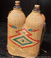 Front view of woven cedar casing with painted geometric motif