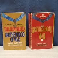 Both paperback books in the Brotherhood of War series by W.E.B. Griffin titled 'The New Breed' and 'The Captains'. Covers show wear and creasing.