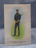 Full view of the tobacco silk showing soldier illustration and background colors.