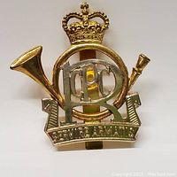Front view of Royal Canadian Postal Corps cap badge showing main design and details