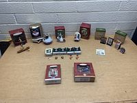 Photo of Hallmark ornaments arranged on table showing boxed and loose items